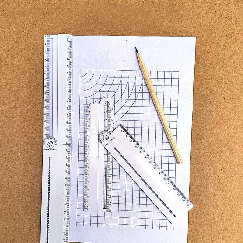White plastic multi-function ruler measuring 30 cm in length on a flat surface.