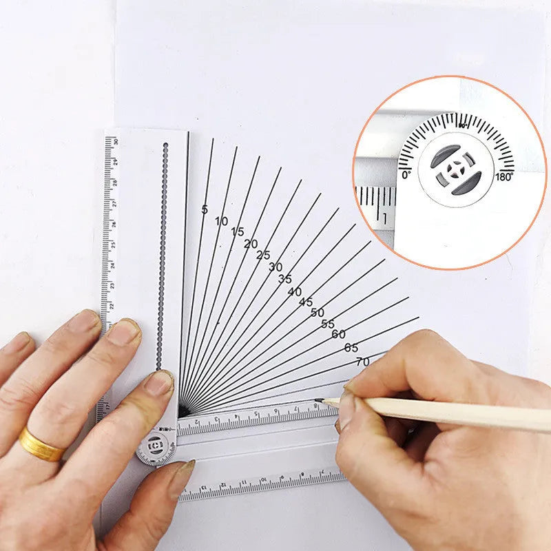 White plastic multi-function ruler measuring 30 cm in length on a flat surface.