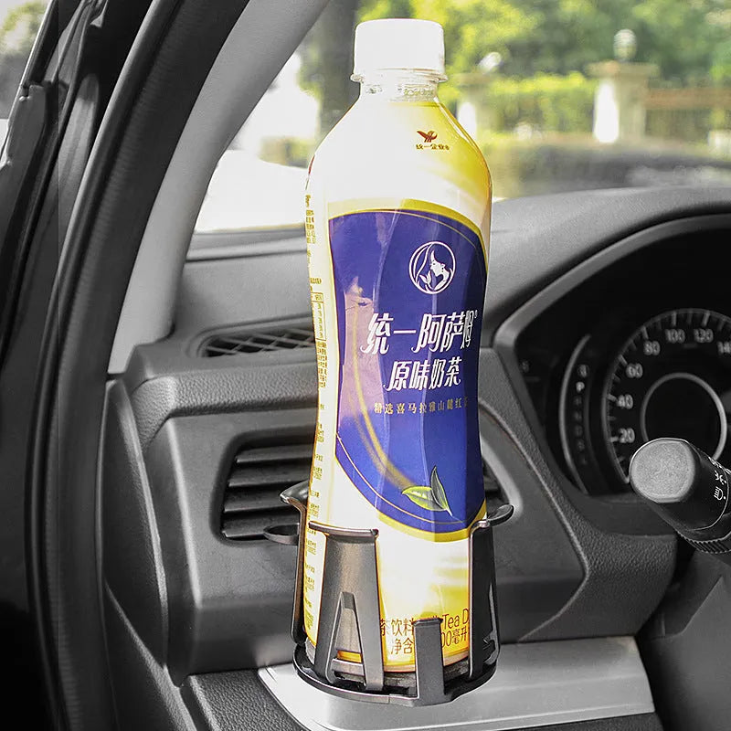 Black ABS car air outlet beverage holder attached to a vehicle air vent showing drink storage