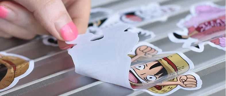 100 mixed graffiti and car themed self-adhesive stickers ranging 6cm to 12cm for luggage and smooth surfaces