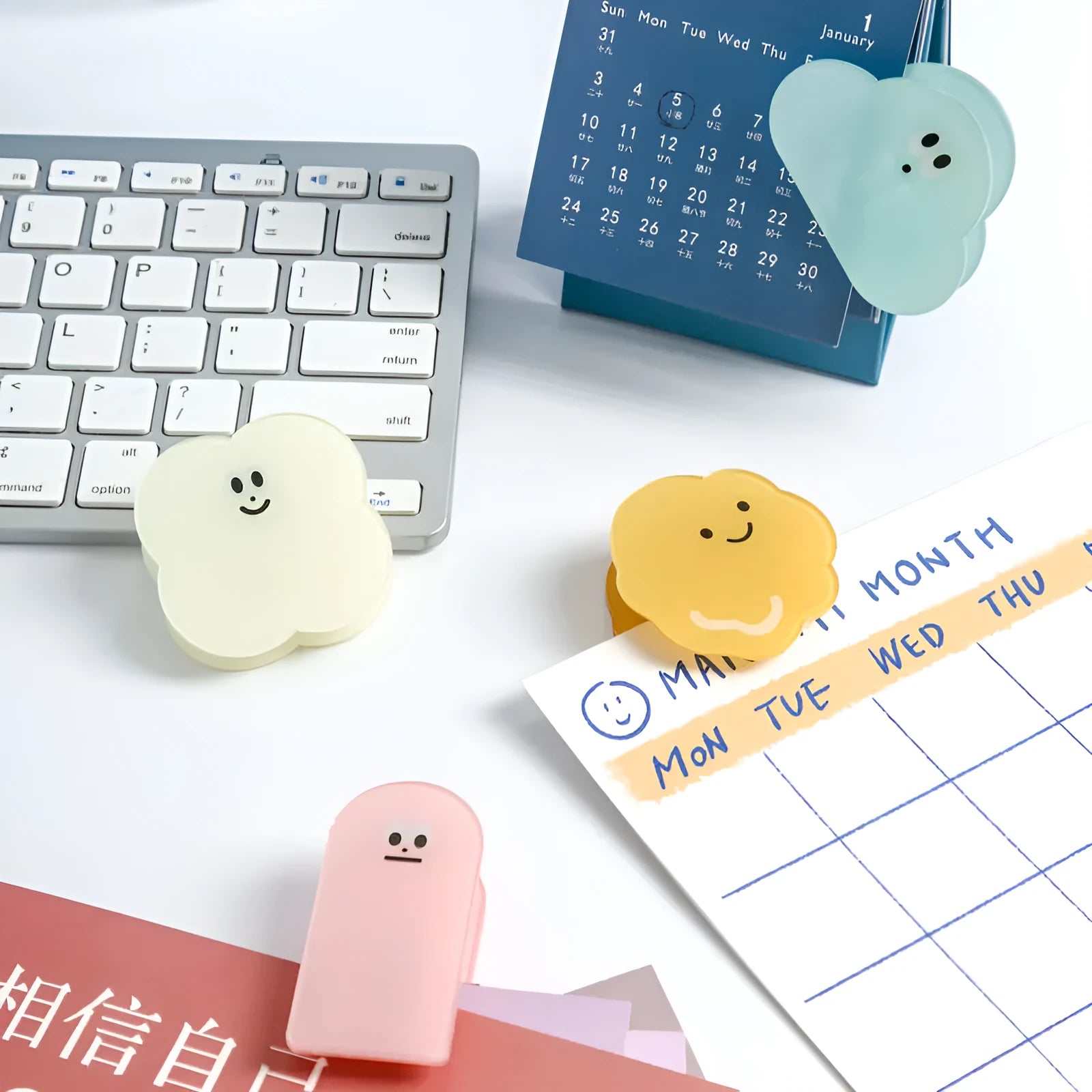Colourful acrylic cartoon collage clip for paper crafts, shown in beige, blue, orange, and pink.