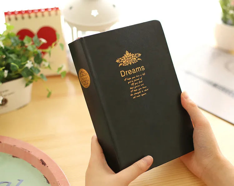 Jingu 35mm thick imitation leather notebook open on a desk.