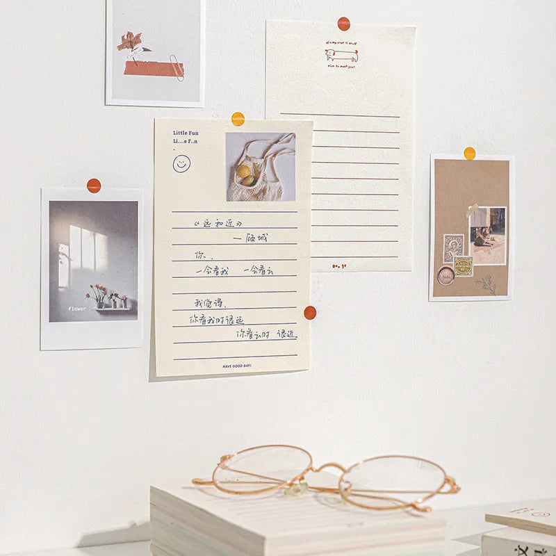 Rectangular memo pad notebook with paper cover compatible with iPhone, showing four colour design options