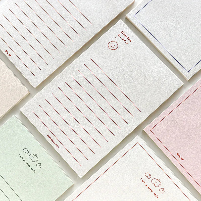 Rectangular memo pad notebook with paper cover compatible with iPhone, showing four colour design options