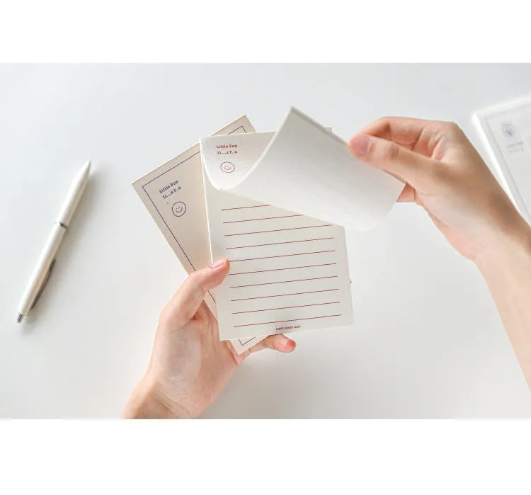 Rectangular memo pad notebook with paper cover compatible with iPhone, showing four colour design options