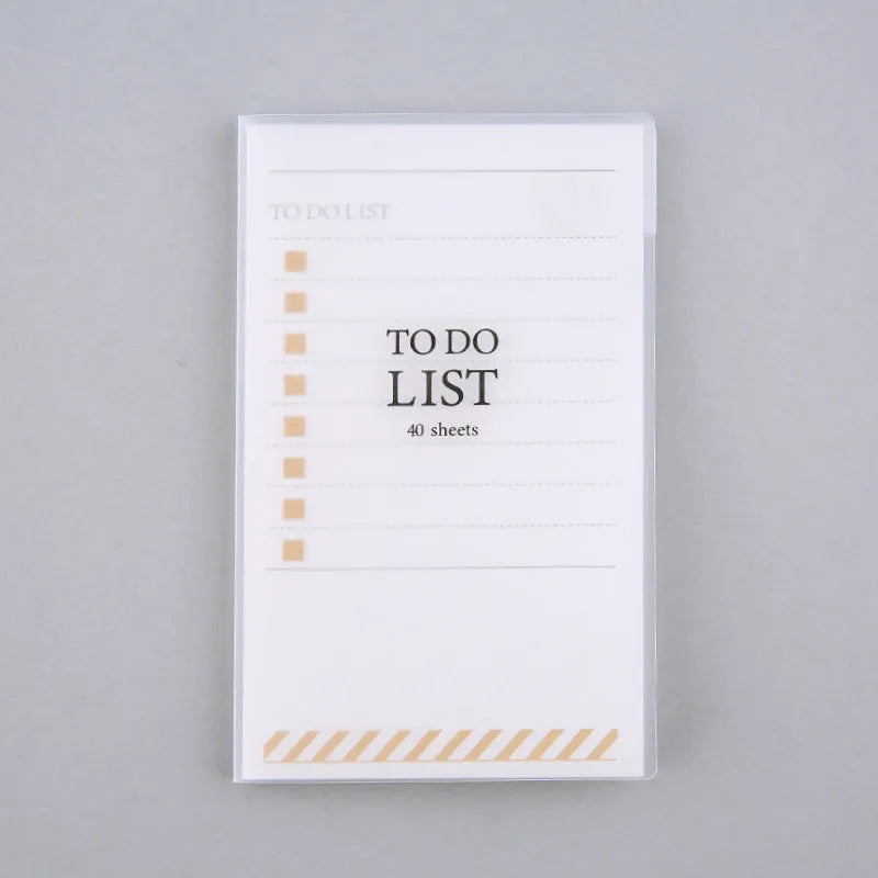 Green PP frosted A6 notebook with tearable pages, shown next to a pen, measuring 13 by 8 cm.