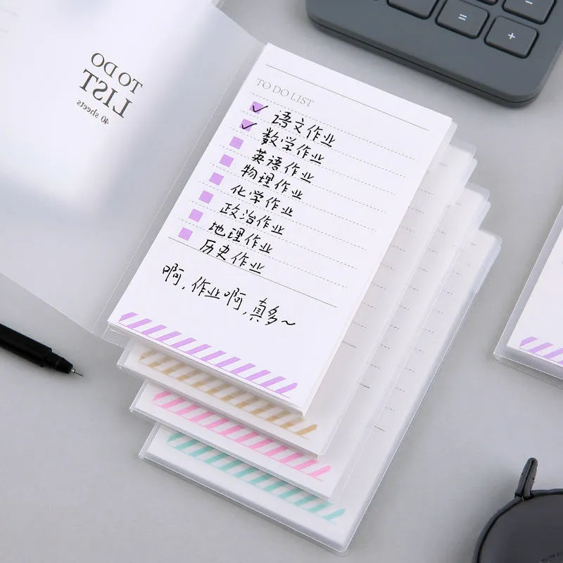 Green PP frosted A6 notebook with tearable pages, shown next to a pen, measuring 13 by 8 cm.