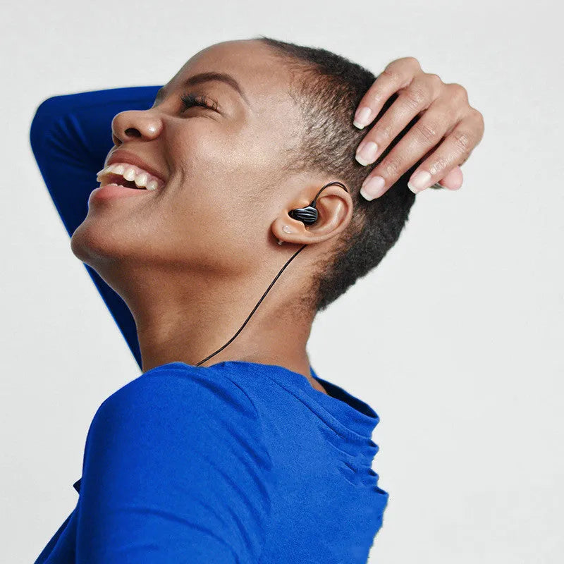 Black in-ear sports headphones with around-ear cable fit and a 3.5mm plug, shown with red and white colour options.