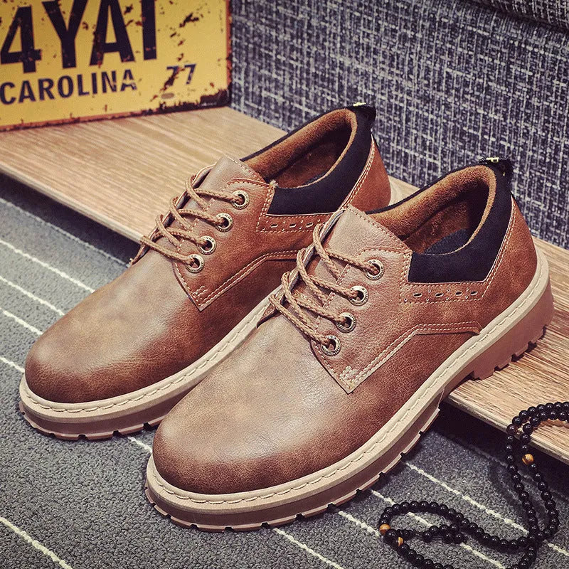 Men's black round-toe lace-up casual shoes with a PU upper and rubber sole on a plain background.