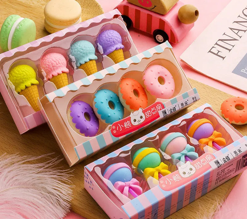 Assortment of 12 colourful cartoon food shaped pencil erasers including ice cream cones, donuts, and lollipops.