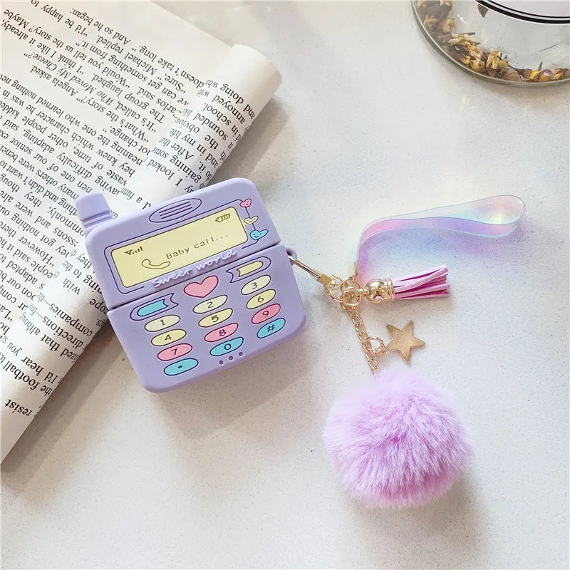 Purple silicone Apple AirPods protective case with fur ball pendant, clamshell design