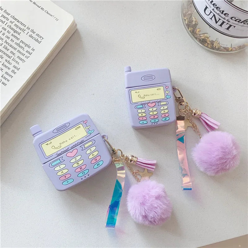 Purple silicone Apple AirPods protective case with fur ball pendant, clamshell design