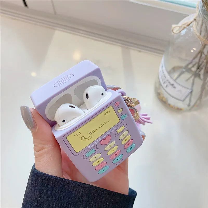 Purple silicone Apple AirPods protective case with fur ball pendant, clamshell design