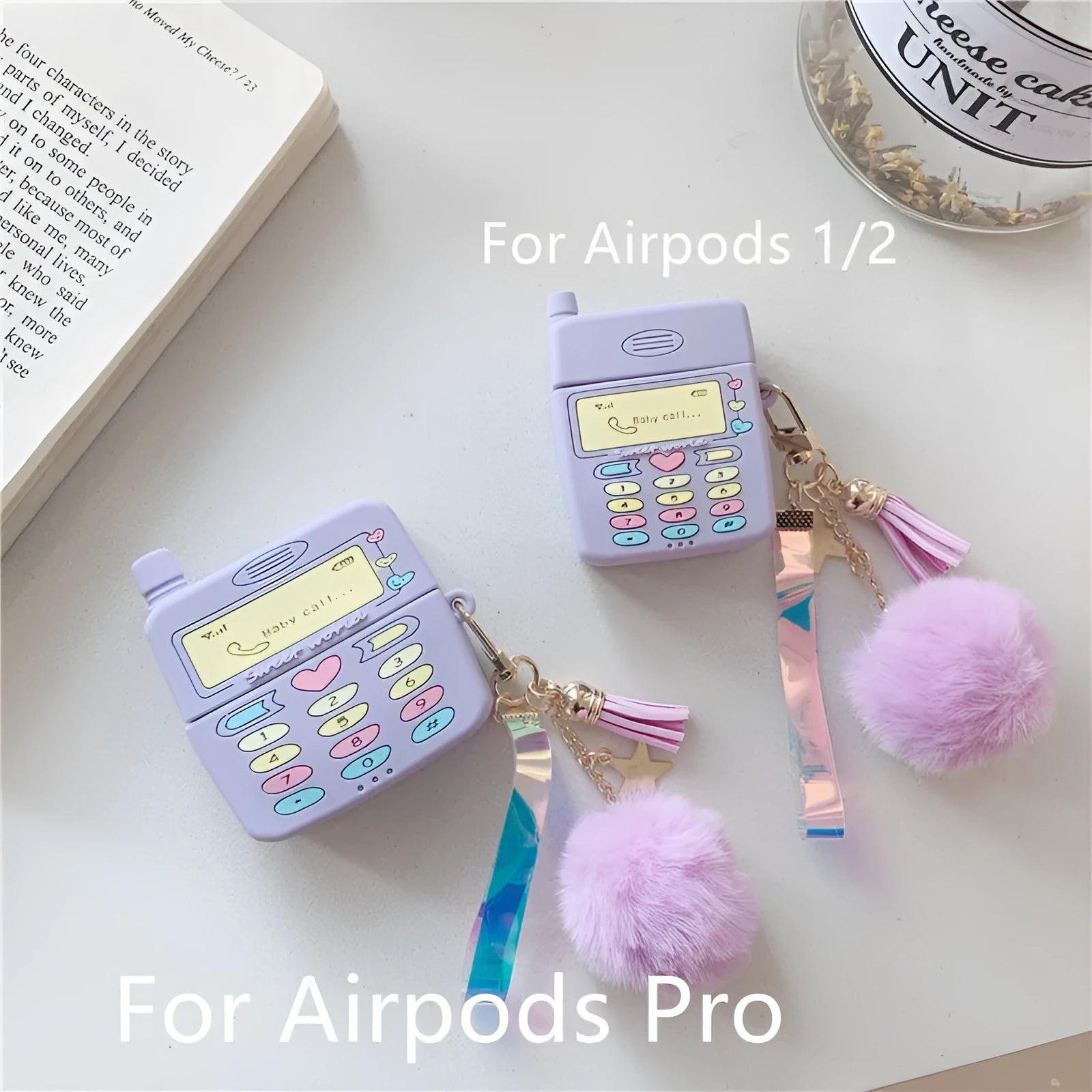 Purple silicone Apple AirPods protective case with fur ball pendant, clamshell design