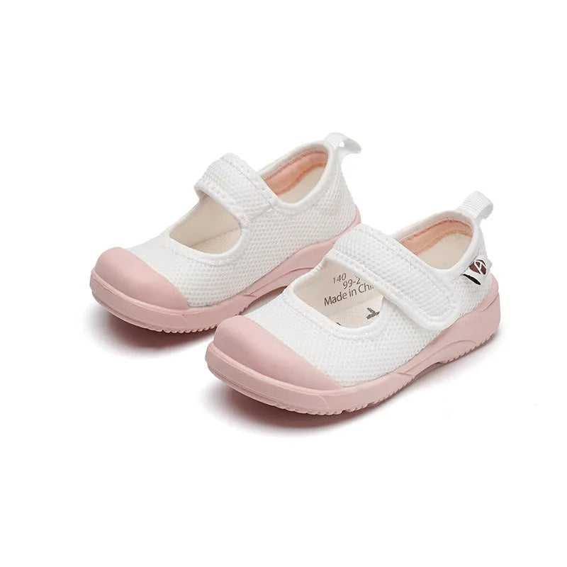 White and pink toddler cloth shoes with mesh uppers and a Velcro fastening strap.