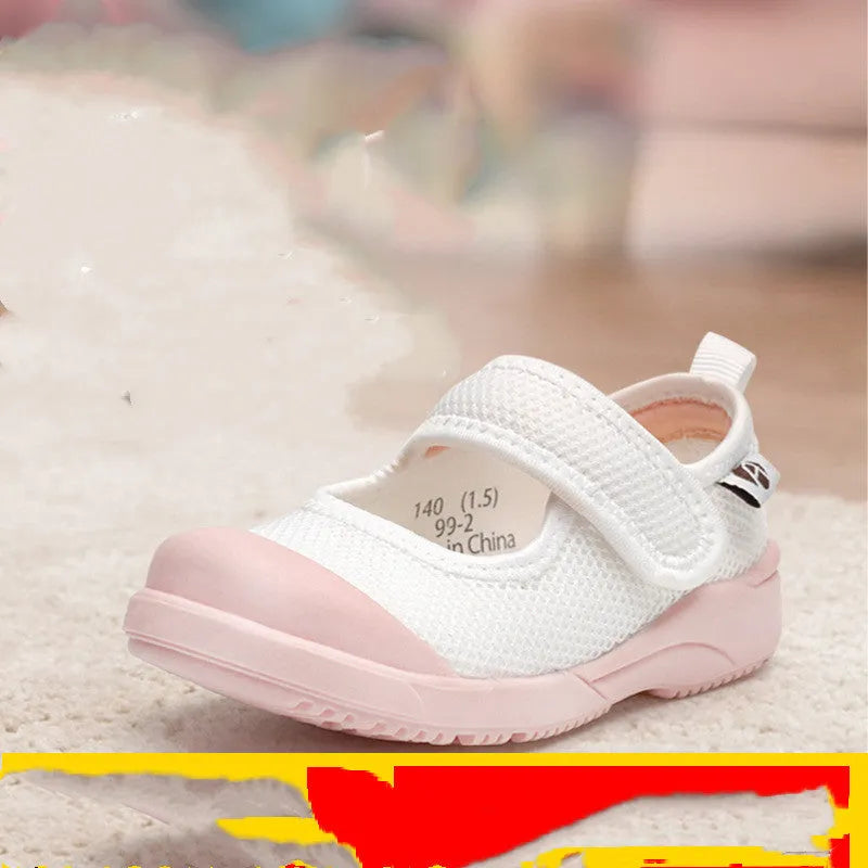 White and pink toddler cloth shoes with mesh uppers and a Velcro fastening strap.