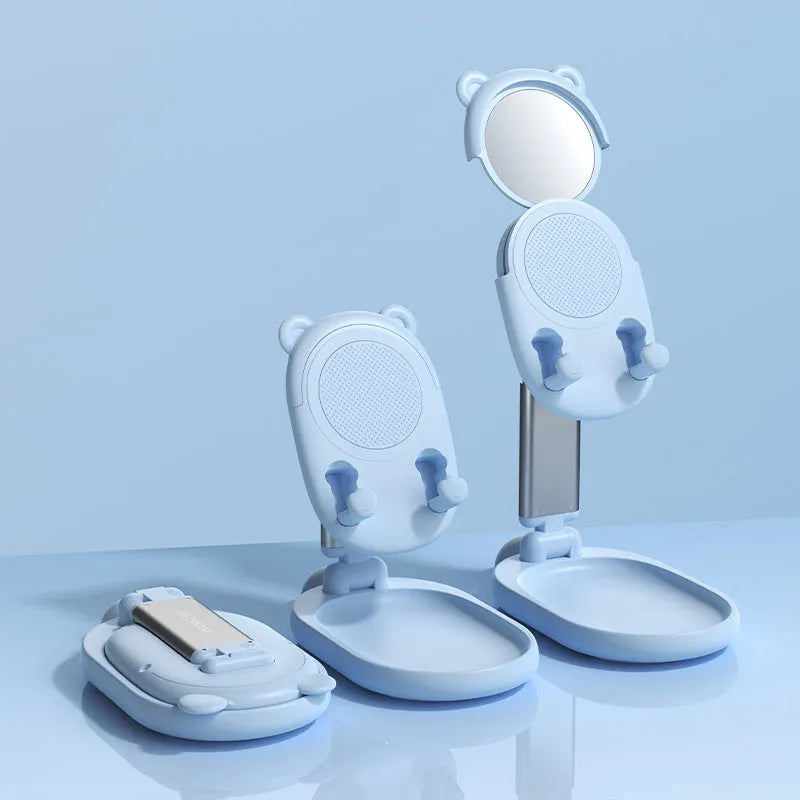 Blue foldable phone holder with mirror for iPhone and iPad on desk