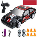 Huangbo red 4WD remote control drift car on a surface showing its 18cm length and plastic construction.