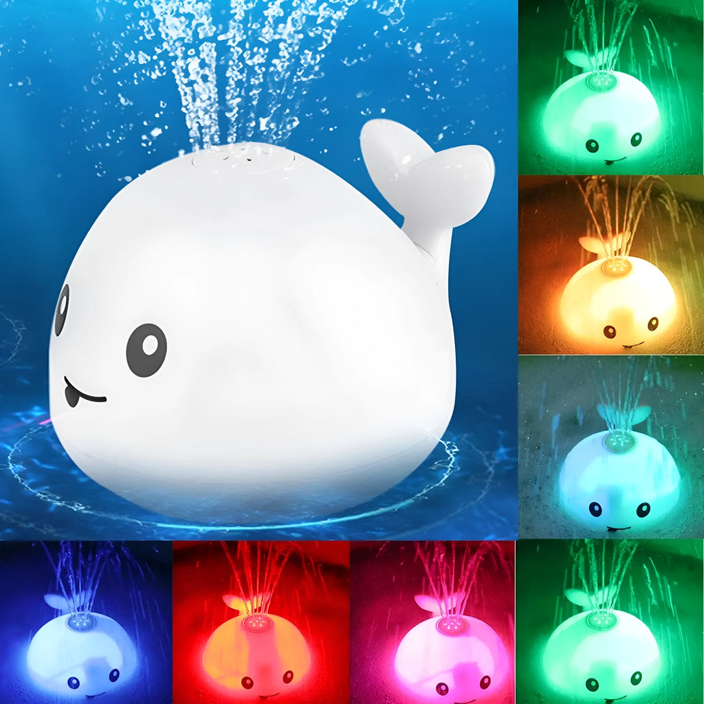 Grey and white cartoon whale bath toy floating in water with spray fountain and LED lights
