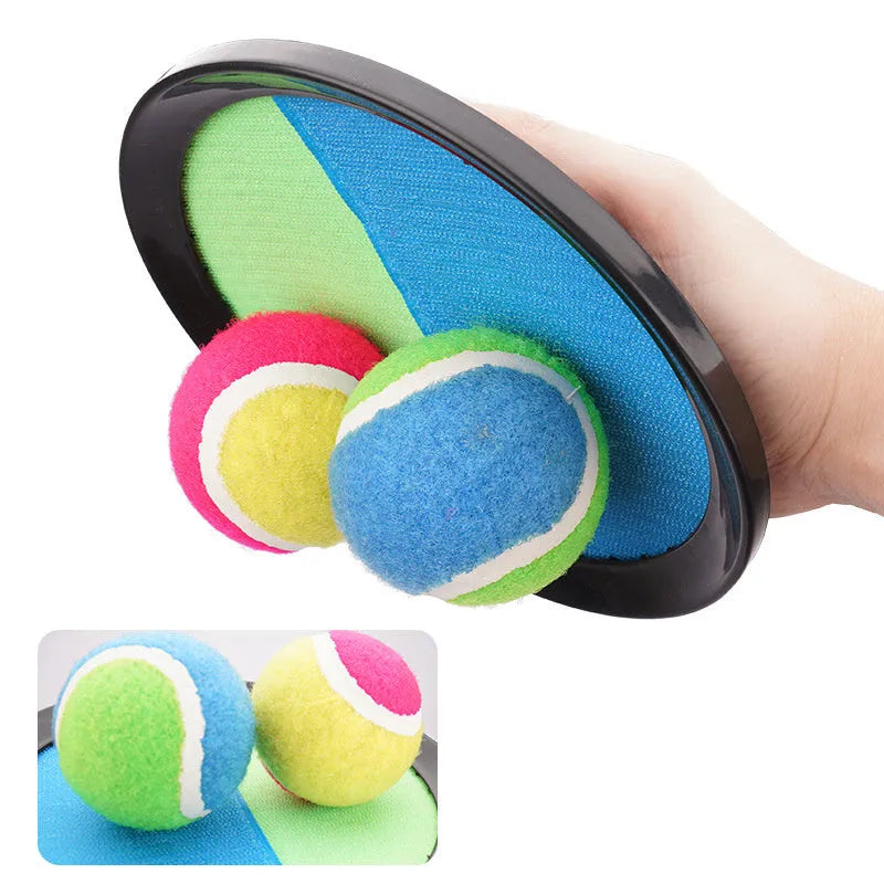 Kids sucker sticky ball toy set with two green and pink self-stick mitts and one flannel ball on grass