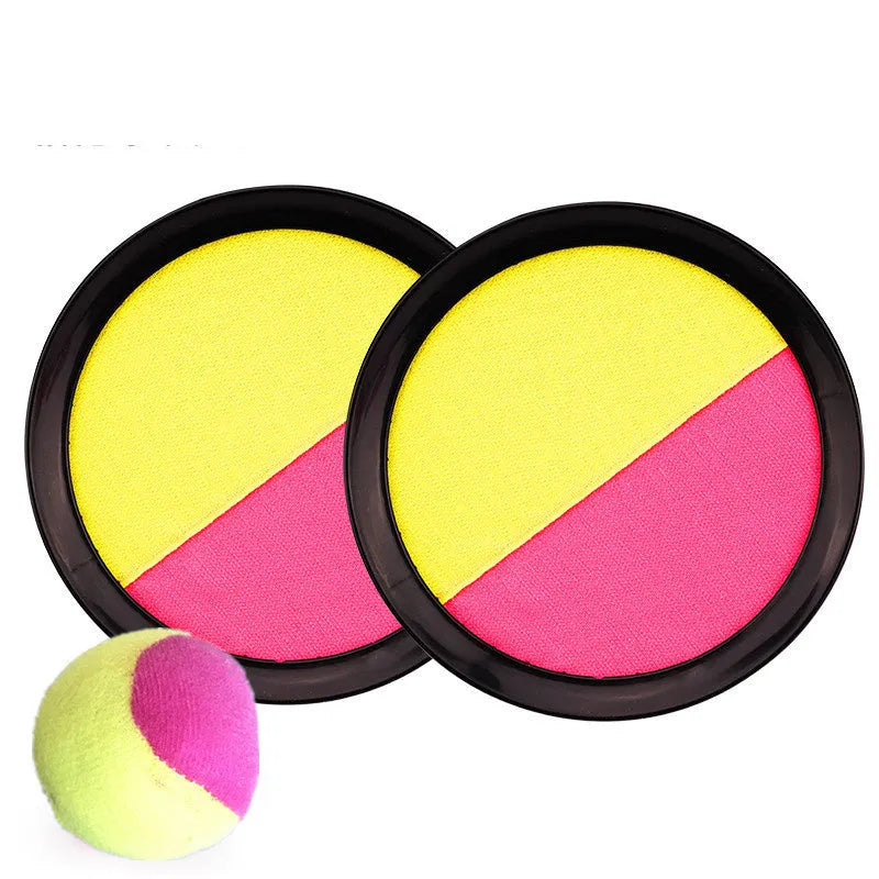 Kids sucker sticky ball toy set with two green and pink self-stick mitts and one flannel ball on grass