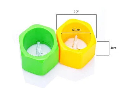 Yellow and green plastic spiral vegetable cutter for slicing cucumbers on a kitchen counter.