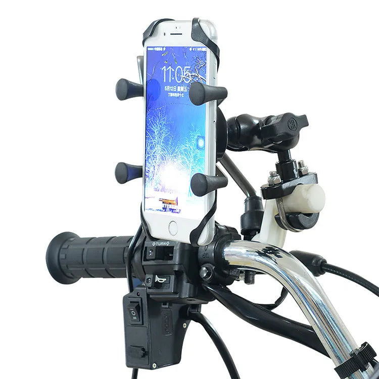 Black aluminium alloy motorcycle phone mount attached to a bicycle handlebar, holding a mobile phone.