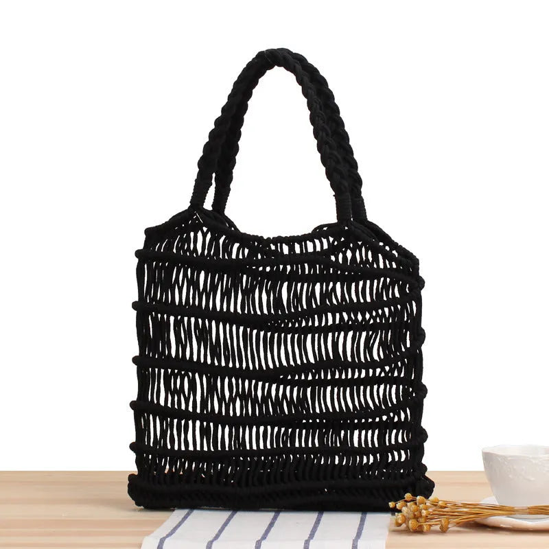 Women's woven straw beach bag with soft handles in medium square design