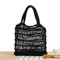 Women's woven straw beach bag with soft handles in medium square design