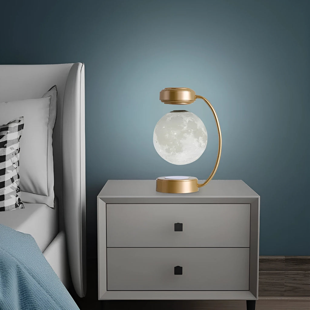 Black magnetic levitation moon lamp floating above base with touch control and colour-changing LED lights