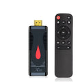 Compact Android TV streaming stick dongle with HDMI connector and remote control.