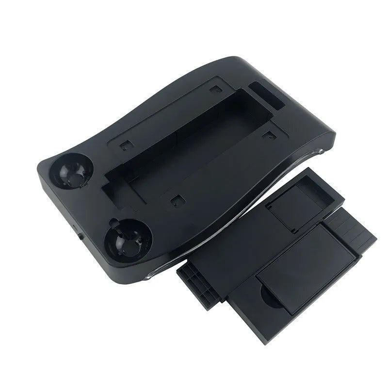 Black ABS plastic PS4 VR game controller charging dock on a flat surface.