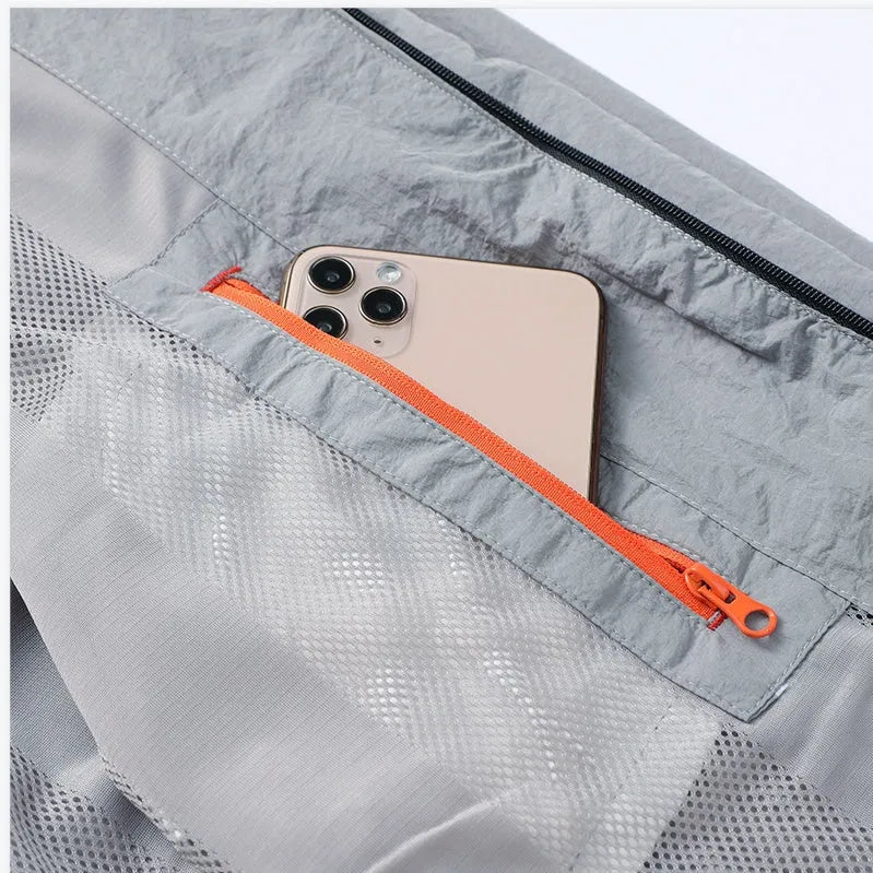 Men's blue polyester summer shirt with fashion city styling on hanger
