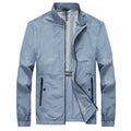 Men's blue polyester summer shirt with fashion city styling on hanger
