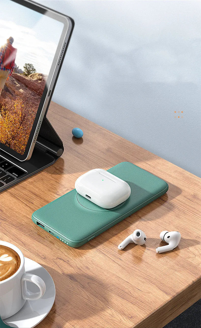 Maiduo mint green Magsafe magnetic wireless charging power bank attached to an iPhone.
