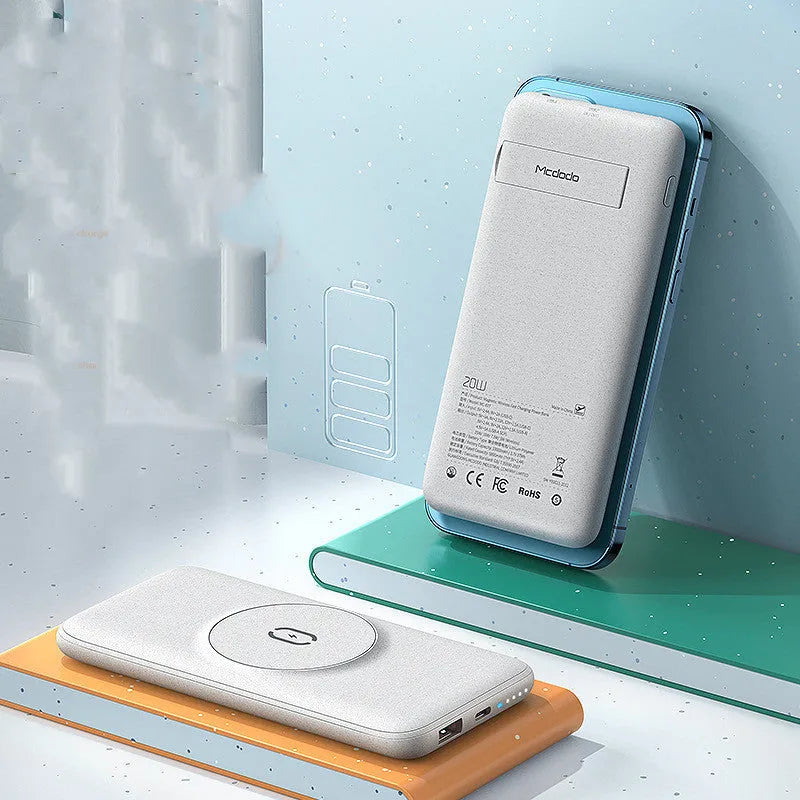 Maiduo mint green Magsafe magnetic wireless charging power bank attached to an iPhone.