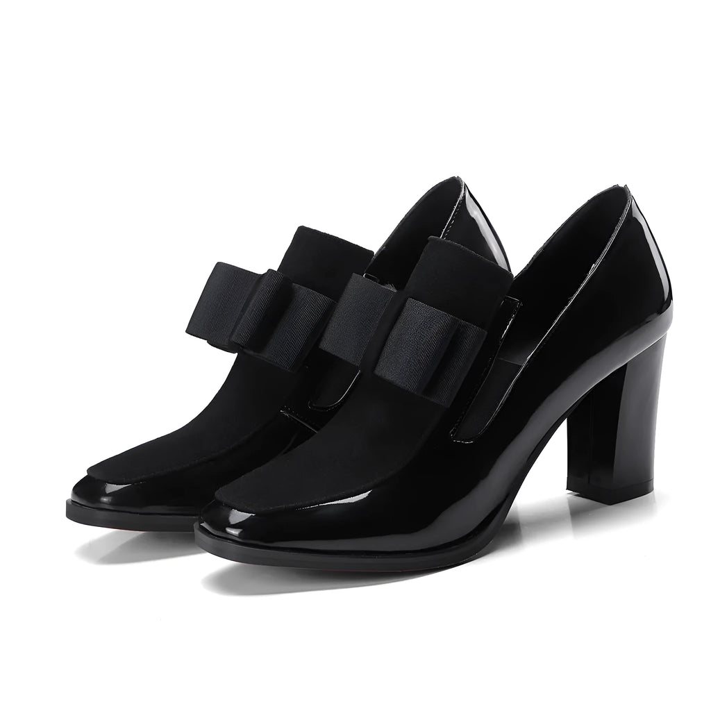 Black patent leather women's high heel shoes with a thick block heel and square toe.