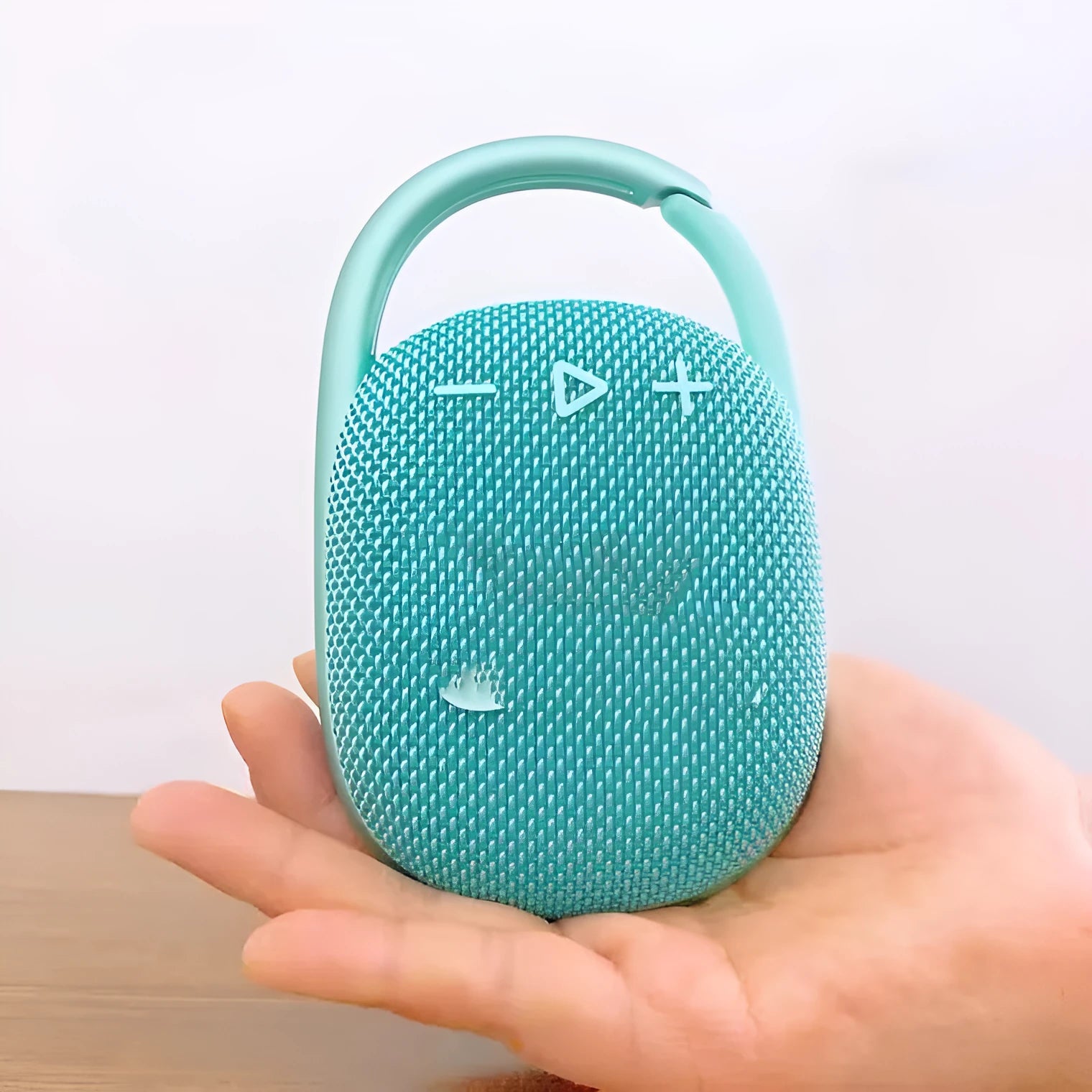 Compact portable Bluetooth speaker in silver grey colour with USB port.