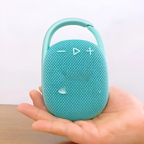 Compact portable Bluetooth speaker in silver grey colour with USB port.