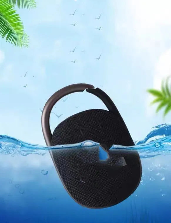 Compact portable Bluetooth speaker in silver grey colour with USB port.