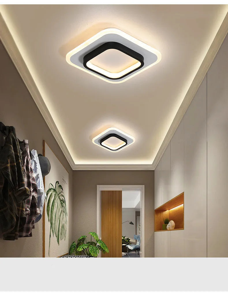 Black circular LED corridor light with aluminium and acrylic construction, 21cm diameter, for balcony or porch use