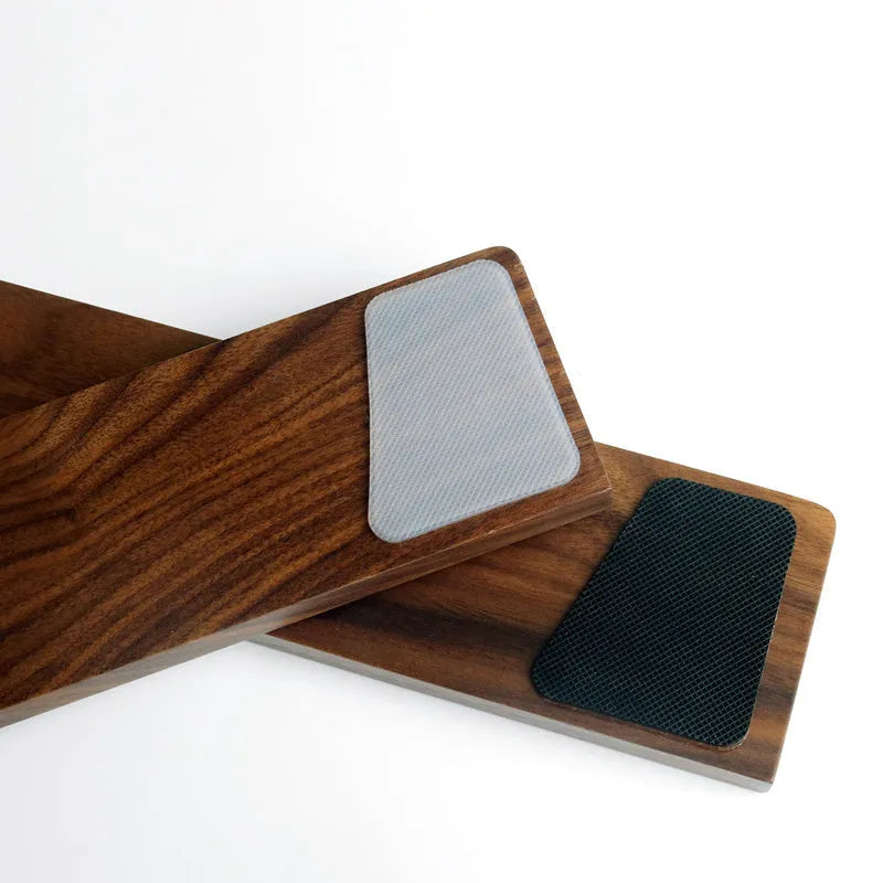 Solid walnut wood wrist rest for mechanical keyboard on a wooden desk
