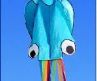 Large 4-metre octopus soft kite in red with 30-metre line and control handle on beach