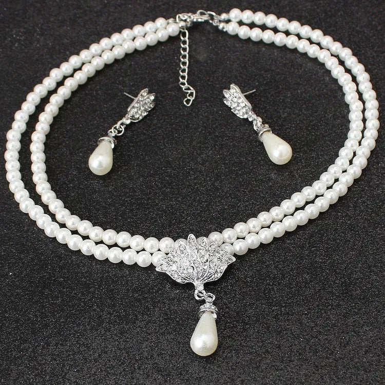 European and American alloy necklace set with pearl and crystal drop pendant and earrings on white background