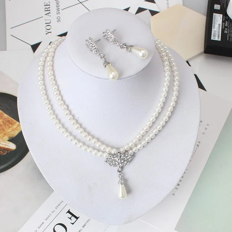 European and American alloy necklace set with pearl and crystal drop pendant and earrings on white background