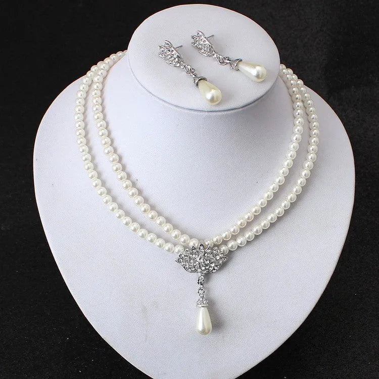 European and American alloy necklace set with pearl and crystal drop pendant and earrings on white background
