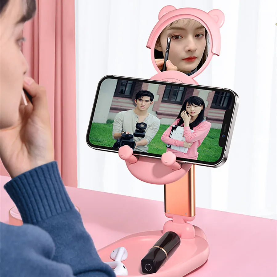 Blue foldable phone holder with mirror for iPhone and iPad on desk