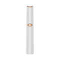Electric eyebrow trimmer in white with LED light, rechargeable battery, and USB cable on a clean surface