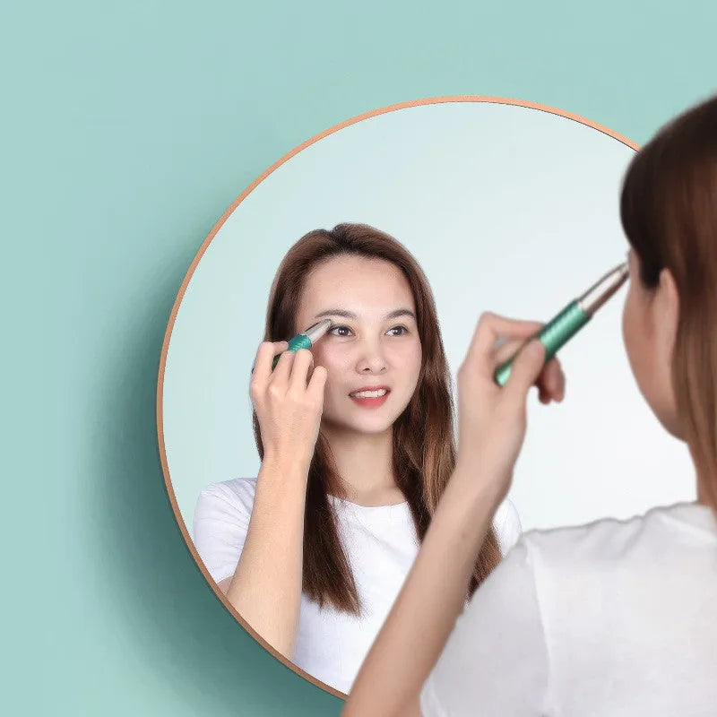 Electric eyebrow trimmer in white with LED light, rechargeable battery, and USB cable on a clean surface