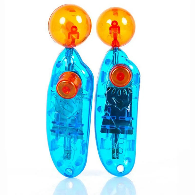 Blue plastic dog training clicker on a light surface for pet obedience training